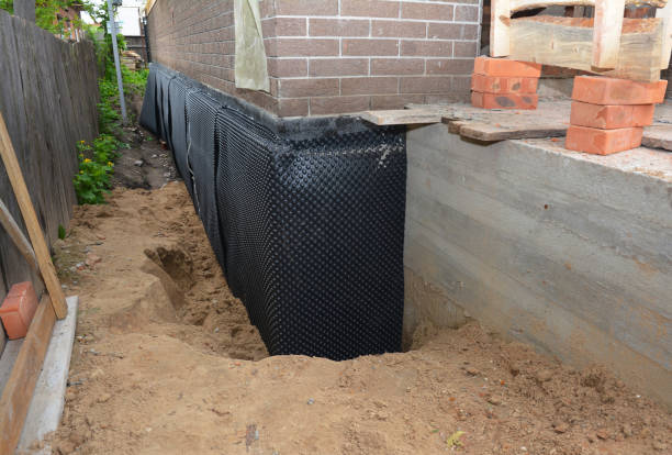 Happy homeowners after waterproofing job in Mount Morris